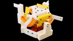 Binary-stiffness Compliant Mechanism that Achieves Two Translations