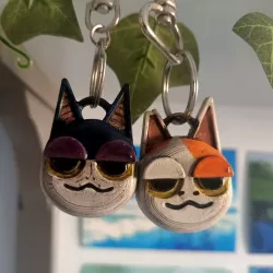 cursed animal crossing cats keychain