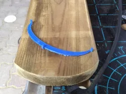Cutting a wooden plank for a fence