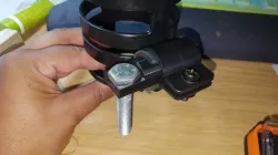 Adapter to secure a cup holder to a wheelchair.