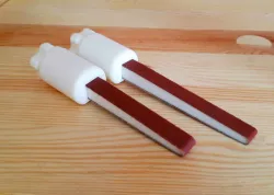 Sanding Stick stick with self-tightening and clamping in one.