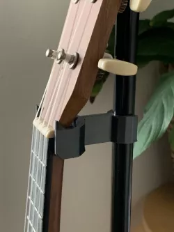 Ukelele holder for sheet music stand
