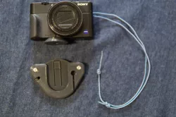 Camera backpack shoulder strap mount