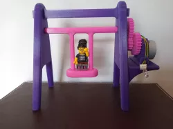 Minature energy generating swing 