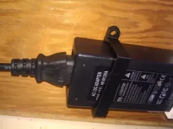 Power supply brick mounting bracket