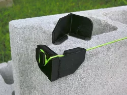 Builder's block line corner anchor bracket