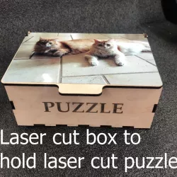 Laser cut box for laser cut puzzle