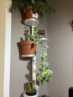 Flower pot holder for pipe