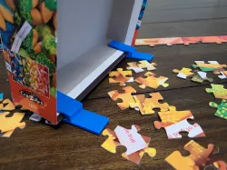 Puzzle box stand and lid holder for jigsaw puzzles