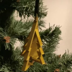 Spinning christmas tree ornament