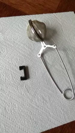 Washing fixture for tea ball