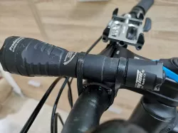 Bike handlebars flexible strap mount