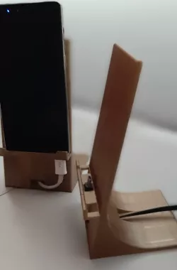 Cellular phone holder with cable grommet