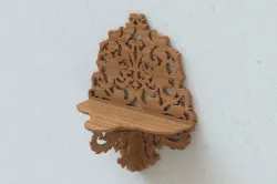Carved wall shelf