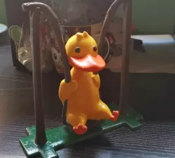 Cute duckling on swing
