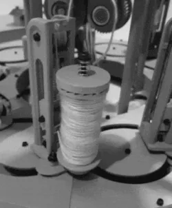 Miniature Bobbin Constant Tensioning Mechanism