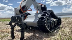 Tank with robotic arm