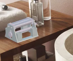 Toothpaste squeezer and toothbrush holder