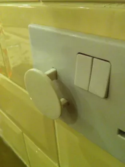 UK mains socket safety cover