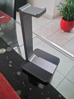 Headset holder with charging cable passage