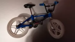 Wheel and handlebar grip for miniature BMX toy