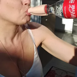 Stylized penis pouring cap for coca cola bottle.