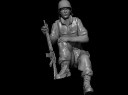 SOLDIER RESTING WITH M16