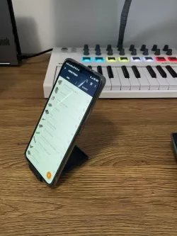 "invisible" phone stand and headphone case holder