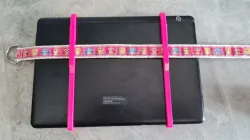 Tablet holder to strap on car sport seat using a band