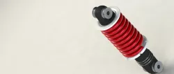 Shock absorber with a dynamic spring