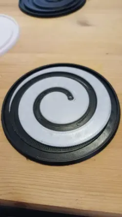 Coaster with spiral drain