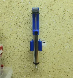 Solder pump wall mount
