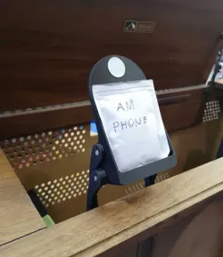 "Stow-away" Cantilevered Phone Stand with NFC tag recess and magnetic position lock