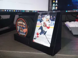 hockey puck display with card holder