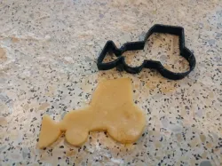 Tractor with front loader cookie cutter