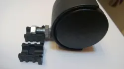 Castering wheel foot enclosure plug