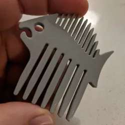 Fish-shaped beard comb