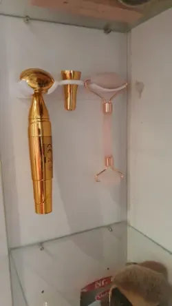 Facial massage tool holder in closet