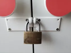 Padlock mount for a cabinet