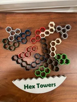 Hex Towers: A Stacking Game with HexErect Pieces