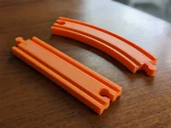 Parameterizable Curved and Straight Toy Train Tracks Compatible with Common Sets