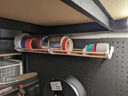 Pegboard tape / wire holder