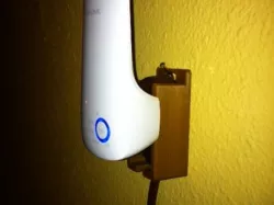 Extension cord wall hanger