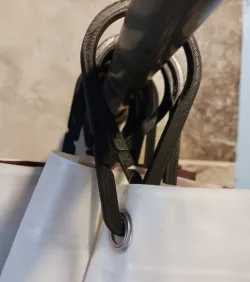 Gravity locking shower curtain ring