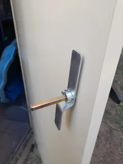 Shed door handle shaft guard