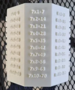 A decagonal pencil box with a MULTIPLICATION TABLE
