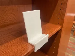 Shelf pinching book stand