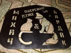 the sign "cat and dog"
