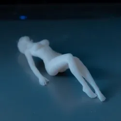 Sexy Nude Girl Lying Down on Table Top