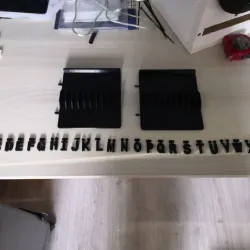 Expandable CD holder with identification letters